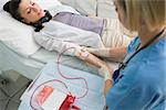 Nurse removing the transfusion in hospital ward