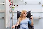 Woman receiving a blood transfusion in hospital ward