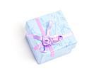 Overhead of blue gift box with purple ribbon on white background