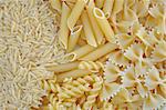 Risoni, penne, farfalle and fusilli. Italian cuisine pasta food varieties background.