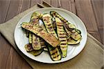 Grilled zucchinis cut to slices in a dish