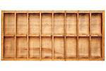 vintage wood typesetter box with 16 numbered bins isolated on white