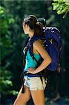 Young woman hiking in summer near Rogue River