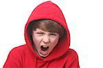 Portrait of an angry young boy on white background