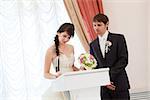 couple signing a wedding document