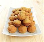 pumpkin muffins on white square plate