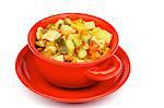 Red Bowl  of Vegetables and Chicken Ragout with Zucchini, Potato, Carrot, Bell Pepper, Tomatoes, Cabbage and Leek isolated on white background
