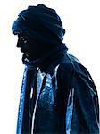 one Tuareg Portrait in silhouette studio isolated on white background