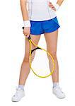 Closeup on racket in hand of tennis player near legs
