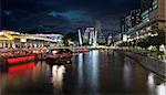 SINGAPORE, SINGAPORE - MAR 13 : Nightlife at Clarke Quay Along Singapore River Panorama at Blue Hour on Mar 13, 2013. A popular tourist attraction in Singapore with boat rides restaurants night clubs historic houses and shopping mall.