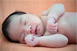 Newborn Asian baby girl sleeping, 7 days after birth