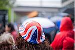 The rain comes down as crowd watches Queen Elizabeth's diamond jubilee parade, Tower Hill, London, UK