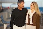 Mature Couple Strolling on Pier, USA