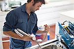 Plumber working on kitchen sink