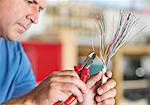 Electrician trimming wires