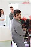 Worker wheeling appliance in kitchen