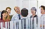 Business people laughing in meeting
