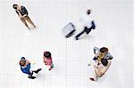 Business people in busy office hallway