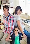 Family smiling together in kitchen