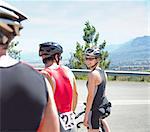 Cyclists talking on rural road