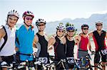 Cyclists smiling together on rural road