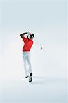 Golfer Swinging,  Back View