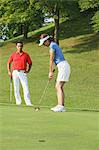 Young Couple Golfing