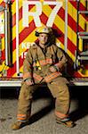 Fire Fighter Sitting on Back of Fire Truck, Ontario