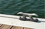 Detail of a wooden floating dock with mooring bitts