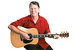 Handsome mature guitarist performing against a white background.