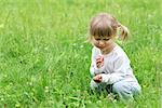 a very beautiful little girl on nature