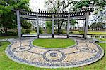 Pavilion in Chinese garden and circle rock path.