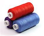 Blue, red and violet coils of threads on a  white background