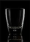 Glass of whiskey on a black background