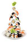 Sushi and rolls falling in the plate. Isolated on white background