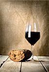 Wine glass and bread and on the wooden table