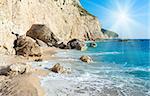 Beautiful summer white Porto Katsiki beach on Ionian Sea (Lefkada, Greece) and sunshine in blue sky