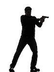 one man killer policeman aiming gun standing silhouette studio white background