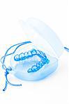 Medical mouthpiece on a white background. This mouthpiece helps to stop snoring.