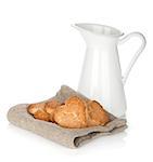 Various cookies and milk jug. Isolated on white  background