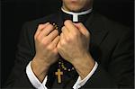 Young Priest praying