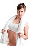 Woman resting with a towel around her neck after a fitness workout, isolated in white