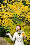 young attractive woman walking in autumn park