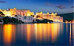 Pichola lake and City Palace at night. Udaipur, Rajasthan, India, Asia