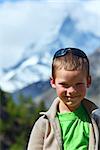 Boy portrait on summer Alps mountain plateau (Switzerland, Zermatt, Matterhorn)