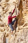 young man rock climbing outdoor