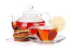 Glass cup and teapot of black tea with lemon and cookies. Isolated on white background