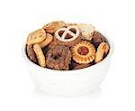 Various cookies in bowl. Isolated on white  background