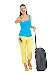 Full length portrait of happy young tourist woman with wheel bag showing thumbs up