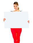 Pretty lady displaying blank placard against white background